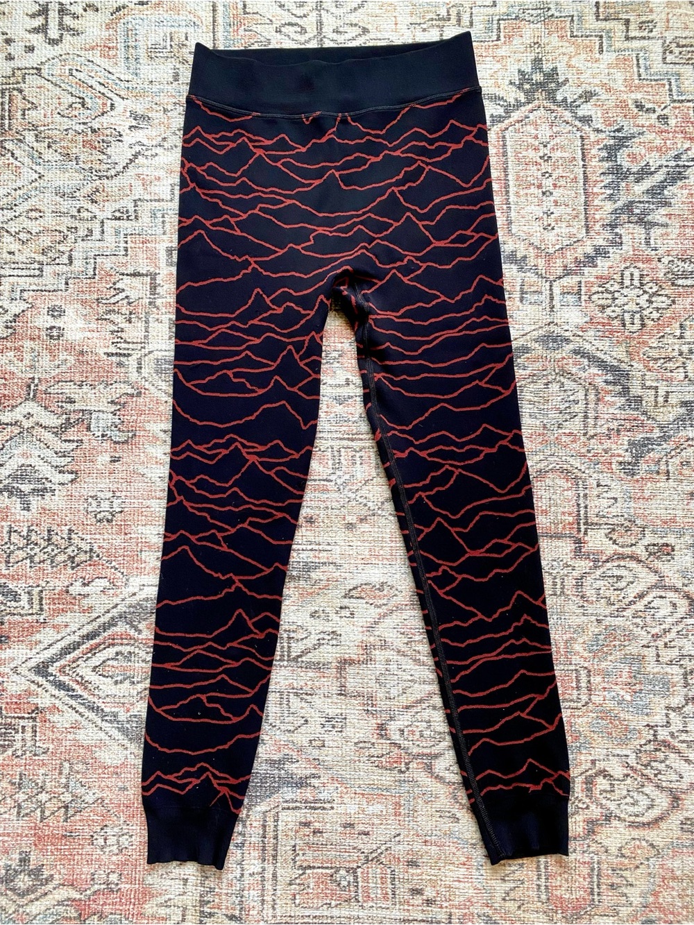 Sweaty Betty Black Leggings with Rust Wave Print